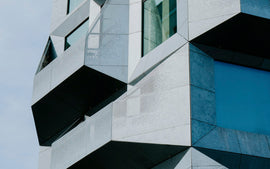 The Silo, a converted grain silo with faceted galvanised steel facade in Nordhavn, Copenhagen