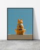 Cat wall art of a golden lucky cat figurine against a clear blue sky