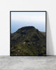 Mountain landscape print of a faint trail winding up a green volcanic peak under a pale sky, Madeira
