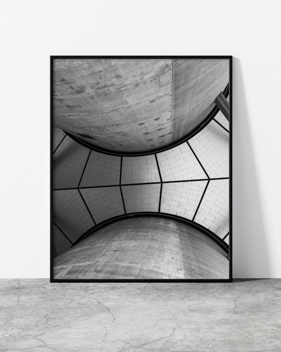Minimalist urban design featuring a domed concrete ceiling framed by angular segments.