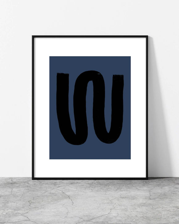 Contemporary wall art with a fluid black form contrasting against a dark blue canvas, creating a modern aesthetic.