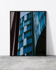 Stylish architecture print capturing intersecting building lines and reflective glass panels in deep tones.