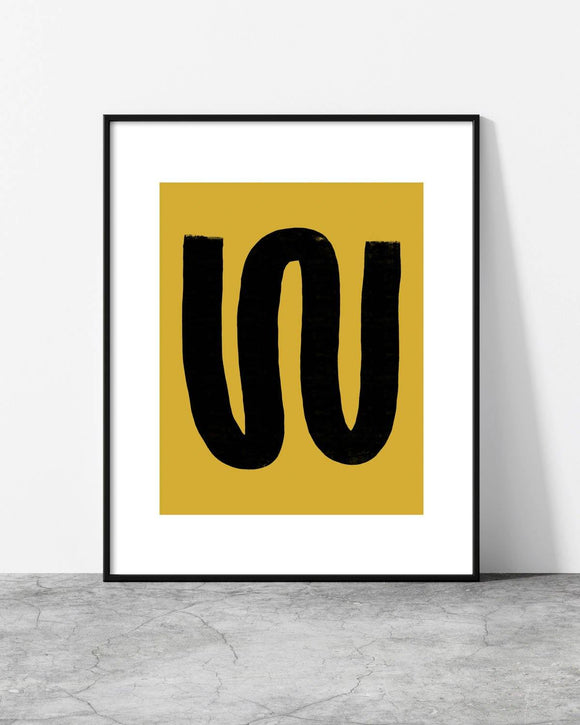 Contemporary wall art with a fluid black form against a warm mustard canvas, creating a modern aesthetic.