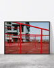 Contemporary urban print capturing a rooftop playground with vivid red structures and modern city views.