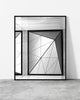 Minimalist black and white architectural photo featuring geometric steel panels framed by raw concrete and clean lines.